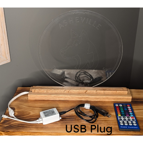 Oak wood base comes with options for power source. Shown here is the USB plug and RGBW remote control to change the lamp color and brightness.