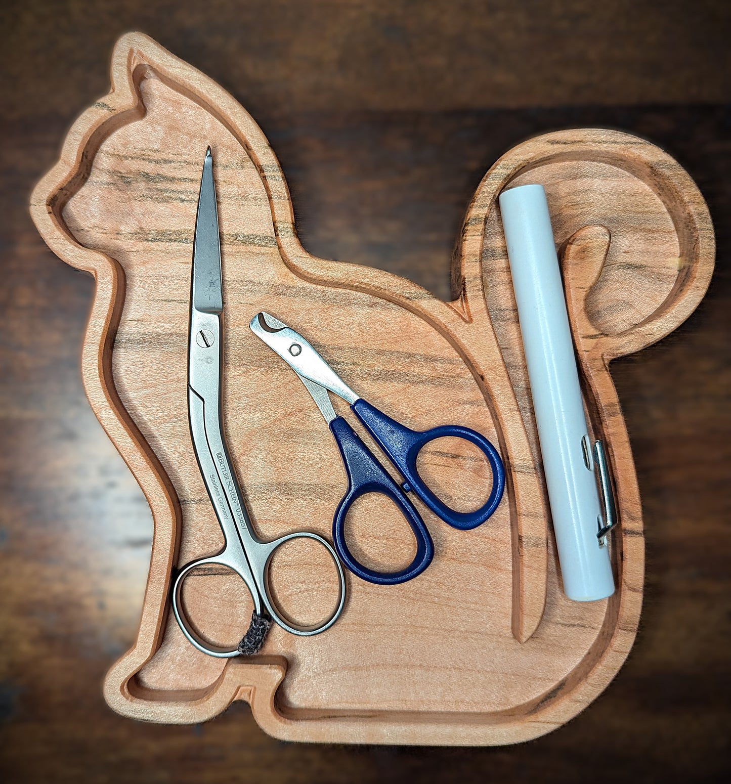 Tray shown holding scissors and cat nail trimmers. Finished with a food safe conditioner this tray can be used for food. Made in Asheville, NC. Perfect for vet techs, groomers, and other cat lovers.