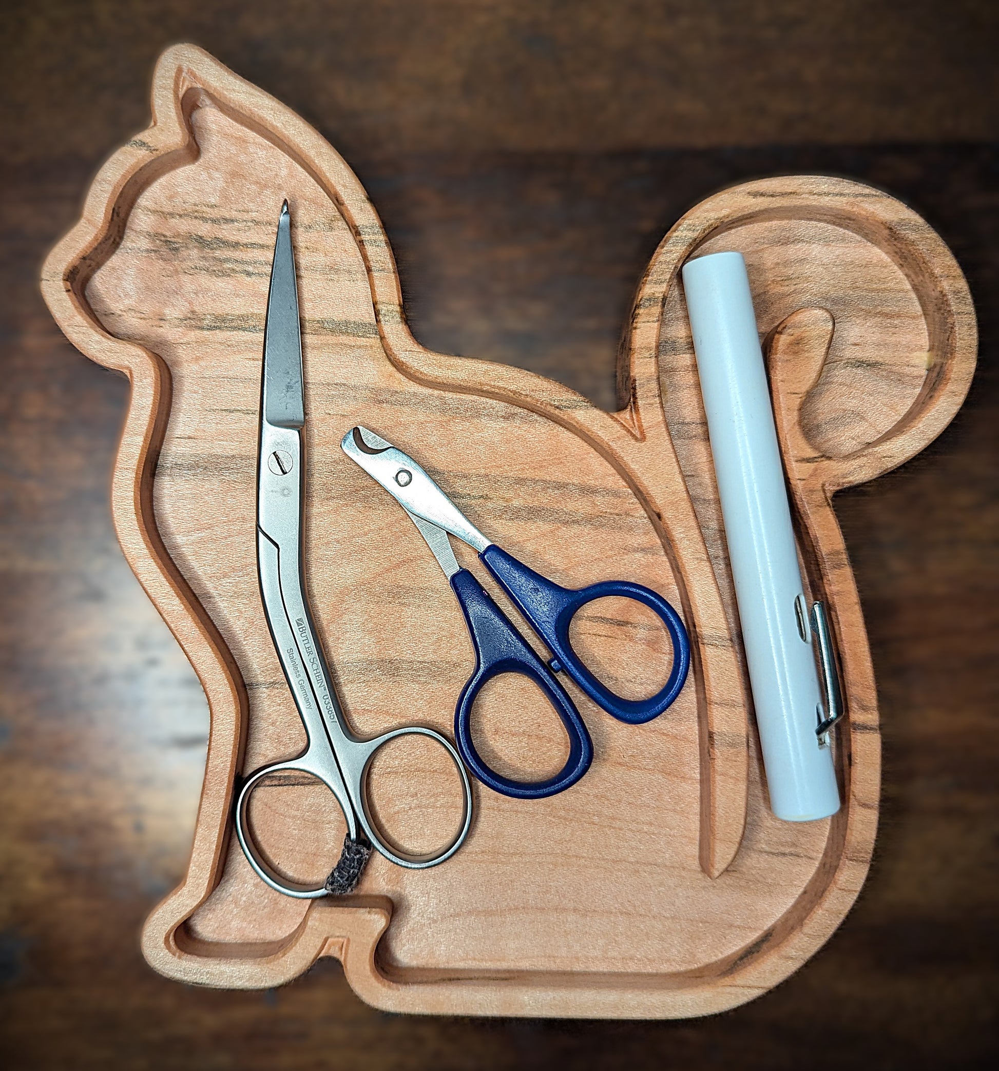 Tray shown holding scissors and cat nail trimmers. Finished with a food safe conditioner this tray can be used for food. Made in Asheville, NC. Perfect for vet techs, groomers, and other cat lovers.