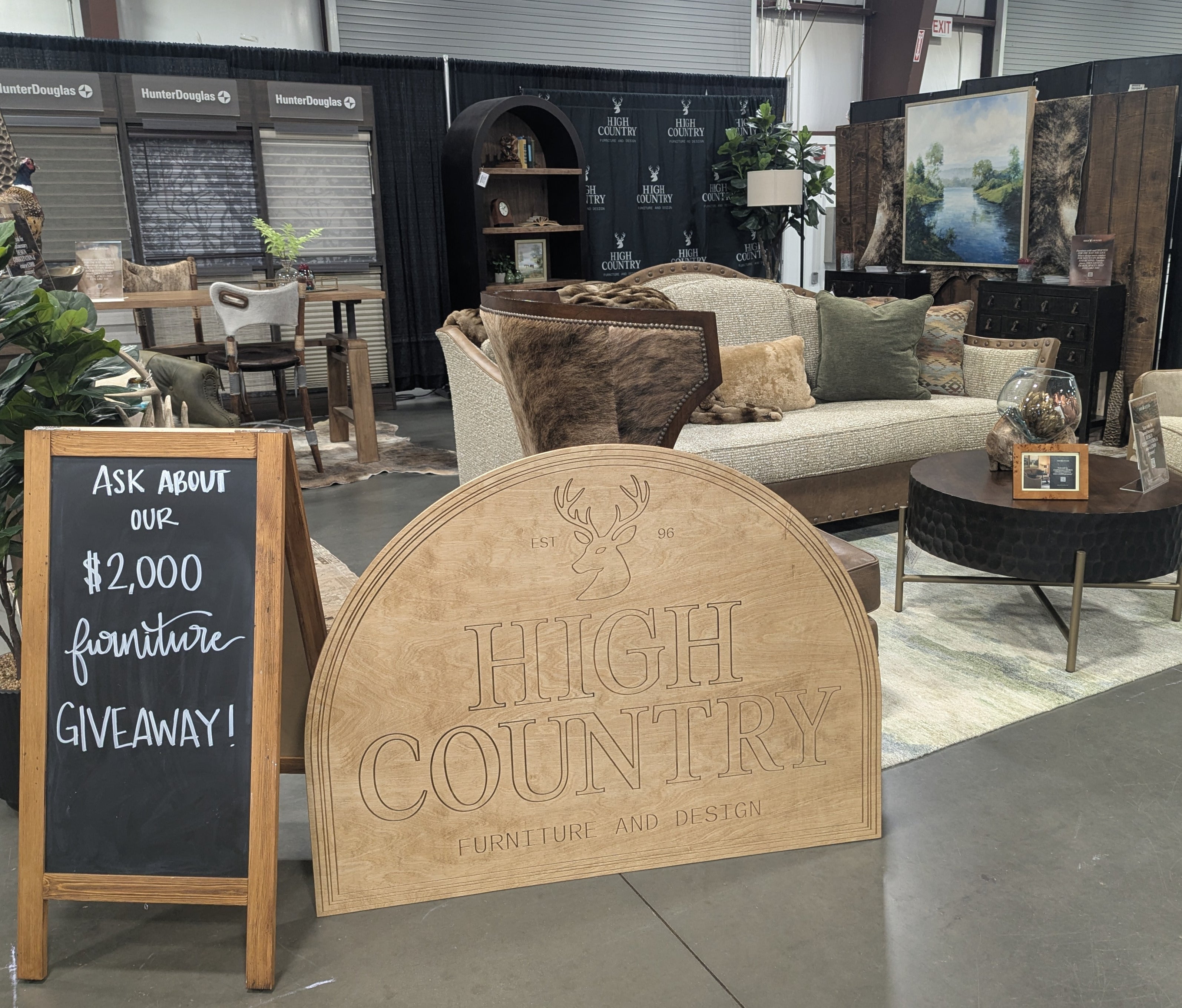 Furniture store interior with 'High Country Furniture and Design' sign and promotional chalkboard.